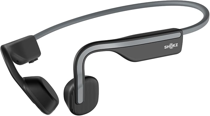 Auriculares deportivos SHOKZ OpenMove de conducción ósea en color negro y gris, diseño ergonómico con diadema flexible y almohadillas abiertas, tecnología inalámbrica para running y entrenamiento