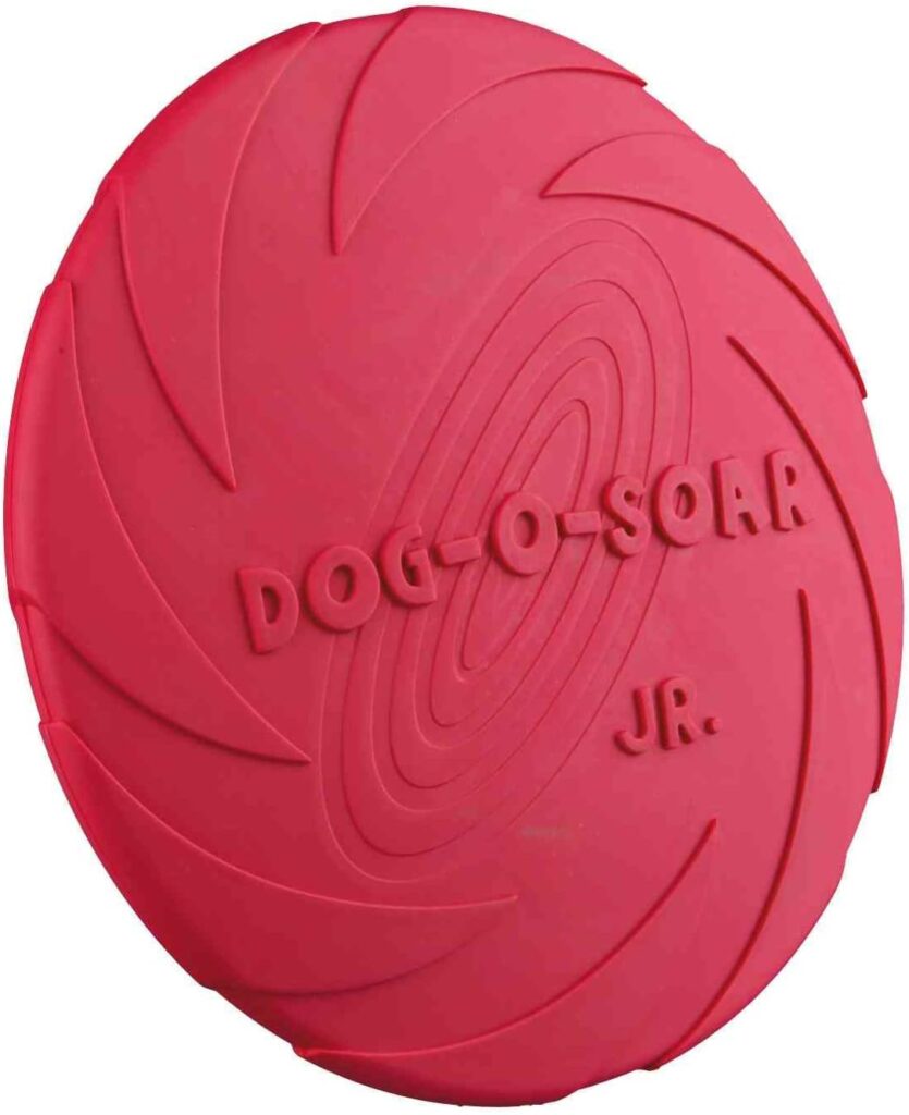 Frisbee para perros Dog-O-Soar en color rojo, fabricado con caucho natural resistente y diseño aerodinámico con textura antideslizante, ideal para juegos interactivos y entrenamiento al aire libre